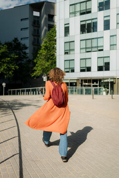Anonymous Woman Walking to Work in a Business District