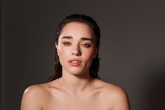 Model Poses for a Close-Up Shot While Looking Directly at the Camera