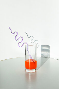Laboratory and chemistry aesthetic. Colored liquid with drinking straw