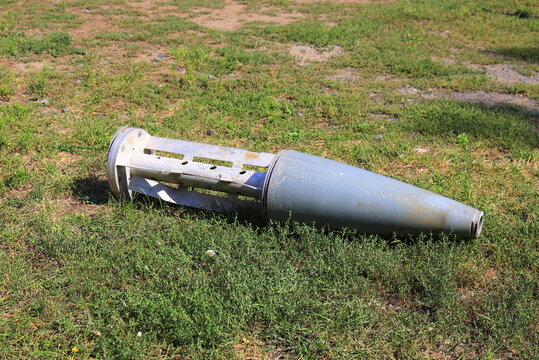 War in Ukraine. Wreckage of Russian missile on grass in Dnipro, Ukraine. Remains of an exploded military ballistic or cruise rocket.