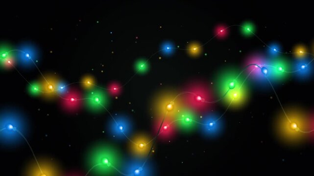 Festive christmas string lights with colorful glowing bulbs on a dark background