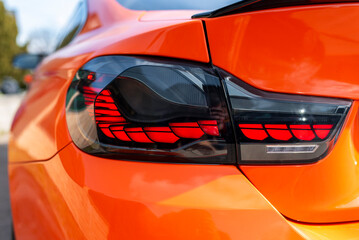Close up of modern car illuminated rear tail light design and technology in detail © ba11istic