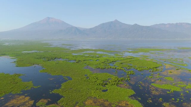 Aerial view of Rawa Pening lake and mountains, Indonesia.