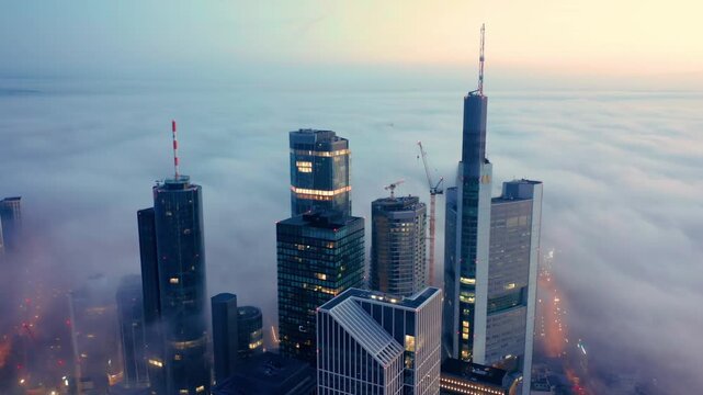 Aerial view of Frankfurt skyscrapers above clouds, Germany.