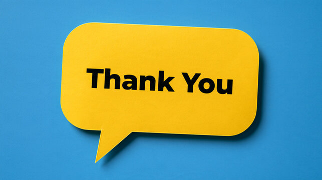 A bright yellow speech bubble with Thank You text resting on a blue background. Ideal for customer appreciation and business communication concepts.