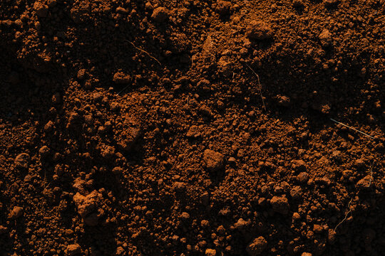 terra rossa soil texture background brown red earth dirt granular closeup croatia garden natural ground surface concept of nature, agriculture, background