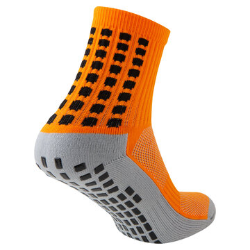 Orange and grey anti slip athletic sock with rubber grips on sole isolated on white background