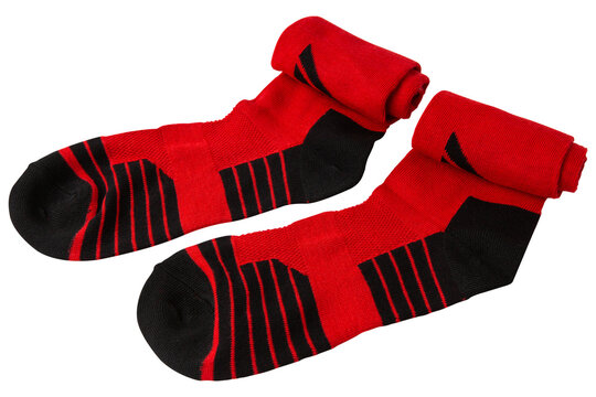 Pair of red and black football socks rolled top isolated on white background