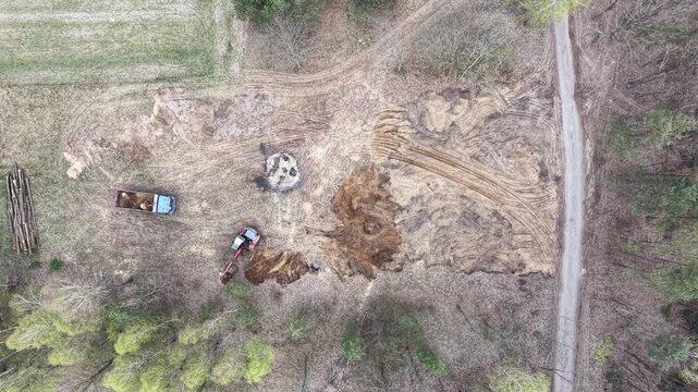 Earthworks happening in a rural forested area
