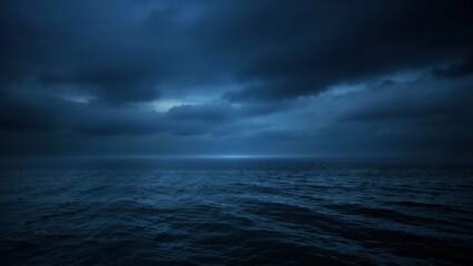 Fototapeta premium Dark moody ocean seascape under a dramatic cloudy sky at twilight