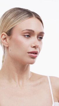 Calm female beauty portrait with natural makeup and fresh facial skin. Advertising for skincare, spa, wellness and cosmetology treatments.