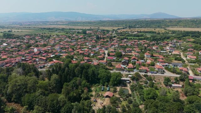 Aerial view of Stob village Bulgaria with red roofs and green forests