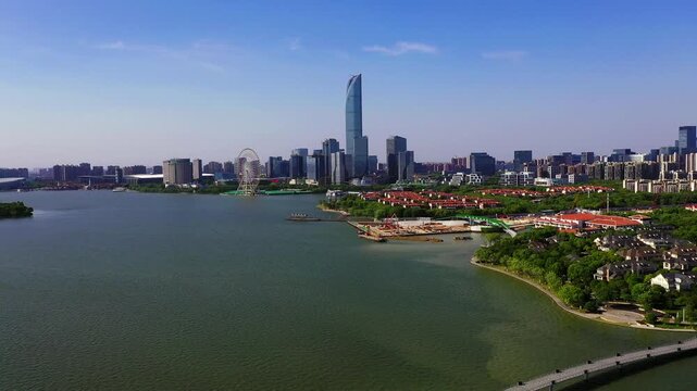 Aerial view of Suzhou Jinji Lake skyline with ferris wheel and waterfront cityscape in China in Suzhou, China