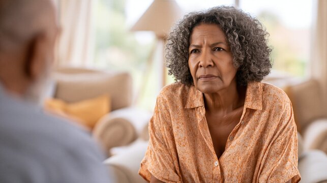 Female Psychologist Listening to Male Patient During Mental Health Therapy Session