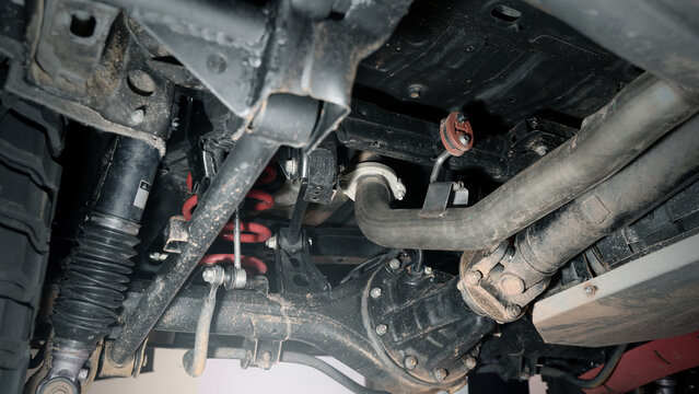 Car suspension and drive shaft. Structure of EV car spare parts. Such as Front or Rear suspension Shock absorber suspension Brake. Elements of the suspension and Chassis structure. Car service repair.