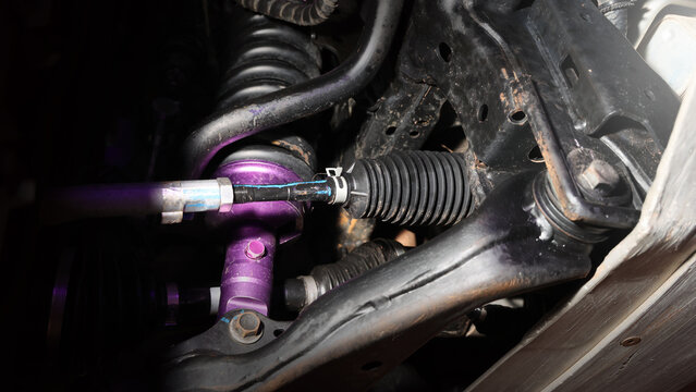 Car suspension and drive shaft. Structure of EV car spare parts. Such as Front or Rear suspension Shock absorber suspension Brake. Elements of the suspension and Chassis structure. Car service repair.