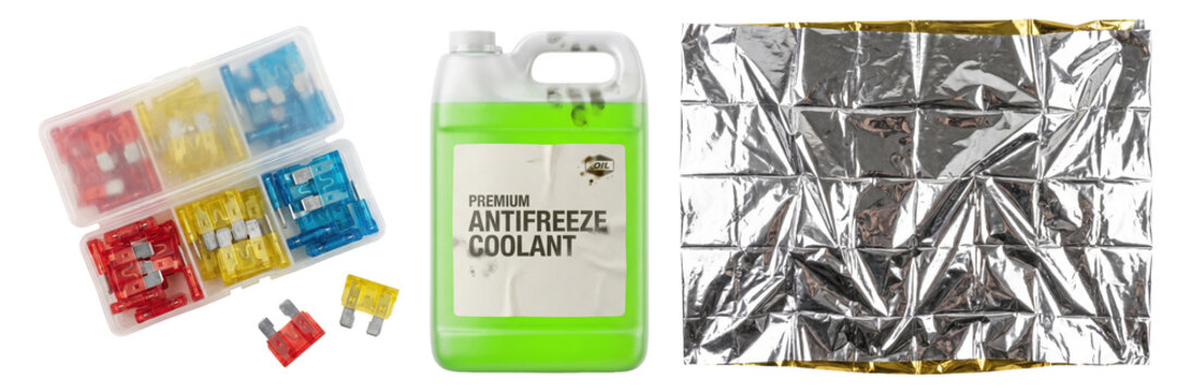 Set of automotive emergency tools with fuse box, antifreeze fluid and mylar blanket isolated on a transparent or white background. Essential roadside assistance kit for cold weather safety.