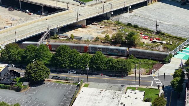 Aerial footage of a train riding on the tracks in Atlanta Georgia USA