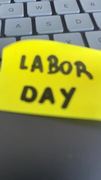 Labor day sticky note close up on laptop keyboard