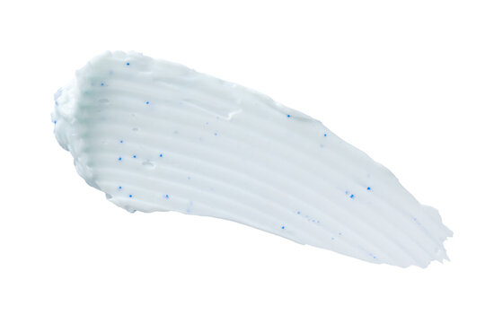 Blue exfoliating cosmetic cream smear with microbeads isolated on transparent background, skincare cleansing scrub or toothpaste texture sample for beauty product design.