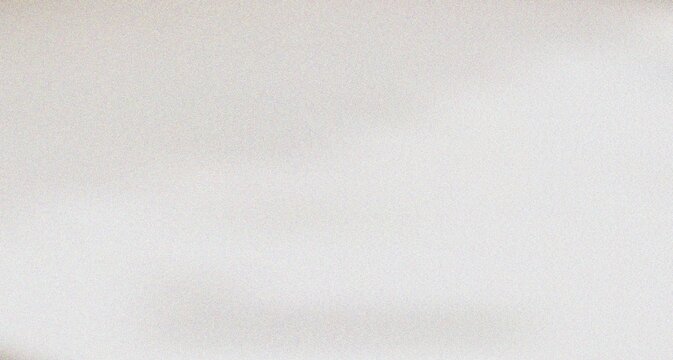 Uniform light gray granular textured surface creating a minimalist and subtly detailed contemporary design element