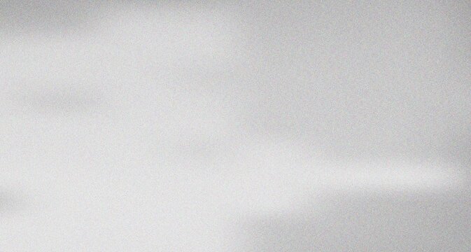 Elegant light gray granular texture showcasing a soft horizontal band of radiant illumination across the surface