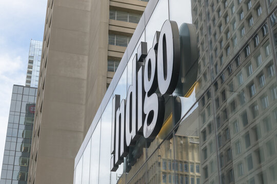 an upward view of Indigo sign at 55 Bloor St W in Manulife Centre, Toronto