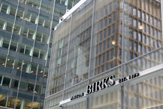 exterior building facade and sign of Maison Birks, a jewelry store chain, located here at 55 Bloor St W in Manulife Centre, Toronto