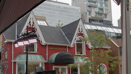 Obraz premium exterior building facade and sign of Christian Louboutin Yorkville, a luxury retailer of shoes, located at 99 Yorkville Av, Toronto