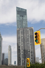 Obraz premium traffic lights and condo buildings in Toronto (at center: 1 The Esplanade, and behind: the L-Tower at 8 The Esplanade)