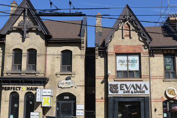 Obraz premium detail of two historic houses (now commercial properties) at 334 and 336 Dundas St W, Toronto