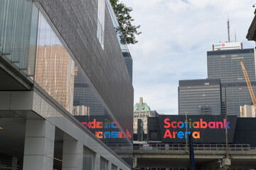 Fototapeta premium looking north from Harbour St to colorful sign on the south facing side of Scotiabank Arena near Bay St, Toronto