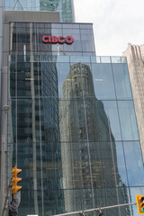 Fototapeta premium glass curtain wall (east elevation) at CIBC Square (141 Bay St) with reflection of 25 The Esplanade, designed by Matsui Baer Vanstone, developed by Avro Group, 1988-89, Toronto