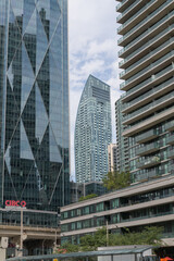 Fototapeta premium contextual view of (at center) L-Tower, a condominium complex, designed by Daniel Libeskind, with Page + Steele / IBI Group, in contemporary deconstructivist style, located at 8 The Esplanade, Toronto