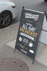Fototapeta premium sidewalk a-frame poster sign of Avenue Open Kitchen, a restaurant, located at 7 Camden St, Toronto (near Spadina Av)