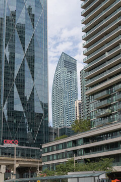 contextual view of (at center) L-Tower, a condominium complex, designed by Daniel Libeskind, with Page + Steele / IBI Group, in contemporary deconstructivist style, located at 8 The Esplanade, Toronto