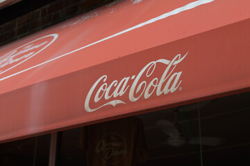 Obraz premium old red awning outside Avenue Diner at 222 Davenport with Coca-Cola sponsor logo in Toronto
