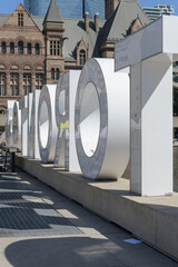 Obraz premium rear of 3d Toronto Sign at Nathan Phillips Square, City Hall, located at 100 Queen St W - late summer
