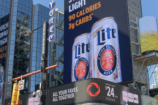 large-format spectacular with advertising for Molson Coors Brewing Company "Miller Lite" facing Sankofa Square, Toronto