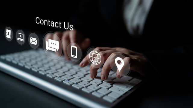 Hands actively typing on a modern keyboard while various contact icons hover nearby, representing the importance of digital communication and online interaction in today world. Gantry