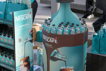 Obraz premium Nescafé novelty table-bins with full-size bottles of espresso coffee concentrate on John St, Toronto