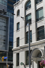 Obraz premium exterior building facade and sign of historic Eclipse Whitewear Company factory located at 322 King St W (site of a Starbucks Coffee shop), Toronto