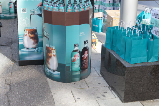Nescaf&eacute; novelty table-bins with full-size bottles of espresso coffee concentrate on John St, Toronto