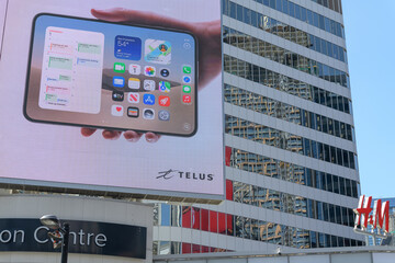 Obraz premium large-format rooftop digital spectacular with advertising by Apple Inc for the upcoming release of the iPhone Duo at Toronto's Sankofa Square