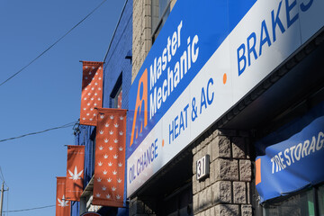Obraz premium signage outside Master Mechanic Queen West an auto repair shop located here at 31 Gladstone Av, Toronto
