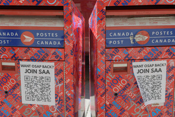 Obraz premium Canada Post street-side collection boxes with posters in Toronto
