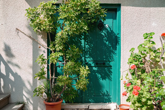 Green door on a sunny day at Laneia village. Limassol District, Cyprus