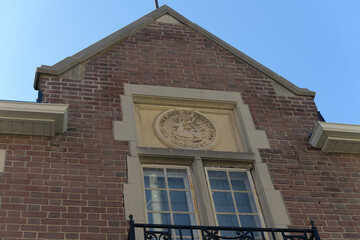 Obraz premium carved stone medallion featuring the old coat of arms for the former Village of Forest Hill, originally Forest Hill Fire Station, 641 Eglinton W, Toronto