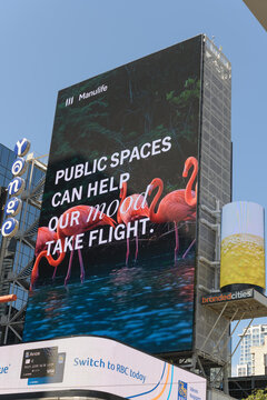 virtue signaling with a corporate budget: Manulife sponsor of environmental and community programs in an ad at Sankofa Square, Toronto ("Public spaces can help our mood take flight")