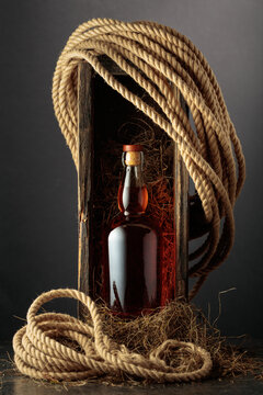 Bottle of whiskey in an old wooden crate.
